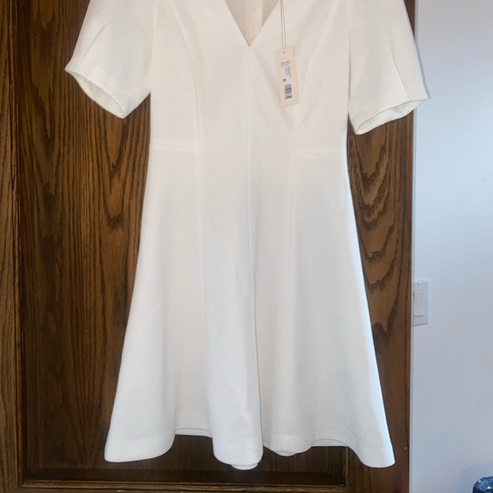 Rebecca’s Taylor white dress never worn